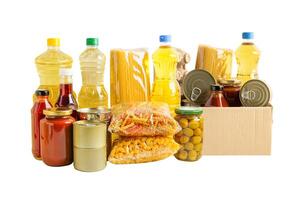 Foodstuff for donation isolated on white background with clipping path, storage and delivery. Various food, pasta, cooking oil and canned food. photo