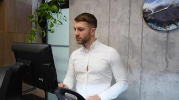 Receptionist welcomes client's tourist and giving key card at hotel front desk video