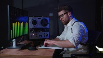 Espionage concept. Spy listens and records conversations on a reel-to-reel tape recorder, intelligence and spying on citizens video