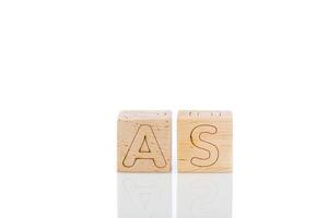 Wooden cubes with letters as on a white background photo