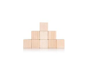 wooden cubes in the form of a pyramid on an isolate white background photo