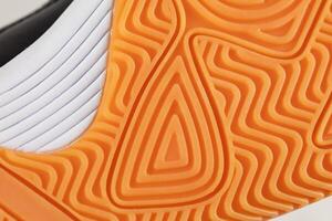Part of a polyurethane shoe sole on a white background. photo