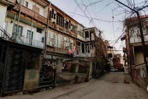 Old shabby houses in the slum district photo