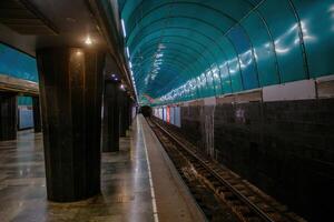 Empty subway station at night photo