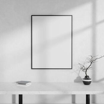 A front view of a white console table and an empty picture frame against a white wall. photo