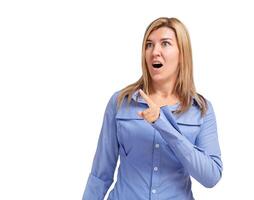 Surprised young woman showing index finger in copy space isolated photo