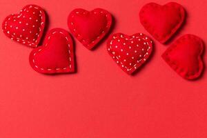 Top view of textile hearts on colorful background. Valentine's day concept with copy space photo