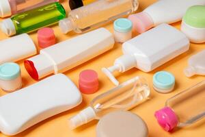 Group of plastic bodycare bottle Flat lay composition with cosmetic products on colored background empty space for you design. Set of White Cosmetic containers, top view with copy space photo