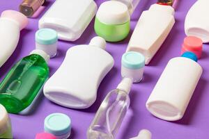 Group of plastic bodycare bottle Flat lay composition with cosmetic products on colored background empty space for you design. Set of White Cosmetic containers, top view with copy space photo