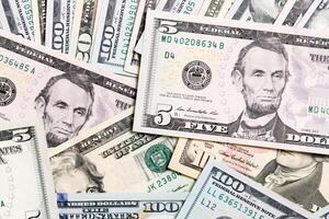 heap of US Dollar bills, money background. Top view of business concept on background with copy space photo