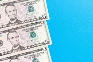 five dollar bills Top view of business concept on background with copy space photo