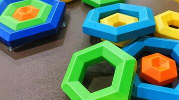 Colorful Geometric Stacking Toy Pieces on a Round Table for Kids Play photo