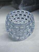 A clear glass container with a unique bubble pattern, ideal for decorative or functional use in modern spaces photo