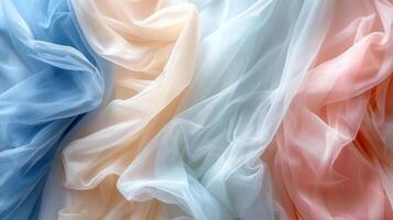 Blue, peach, and light pink sheer fabric in a wavy pattern. photo
