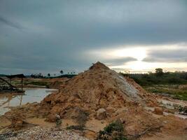 background photo of pile of soil in the middle of the field suitable for desktop wallpaper, Instagram story, TikTok, Facebook, etc.