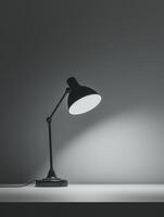 Monochrome photography with modern desk lamp gently casting soft shadows in a beautifully minimalist workspace environment photo