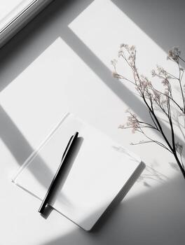 Photography with a serene workspace with a blank notebook, a cup of coffee, and greenery creating a tranquil atmosphere photo