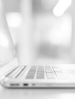 A Sleek Laptop Positioned Elegantly Within a Modern and Stylish Workspace Setting photo