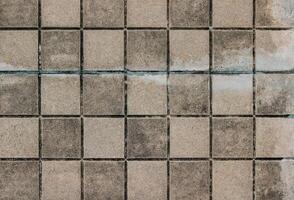 Background of old dirty concrete tile floor pattern texture. Abstract background and texture for design. photo