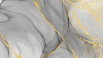 Abstract gray and gold alcohol ink background with flowing lines and texture. photo