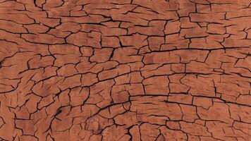 This red clay surface is cracked from drought. photo