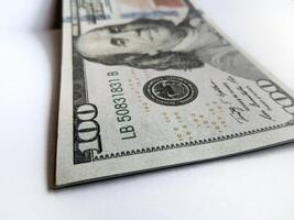 A close up of a hundred dollar bill photo