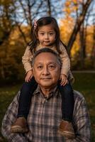 Loving Embrace Between Grandfather and Granddaughter in Autumnal Garden photo