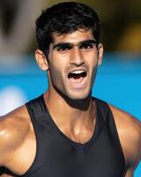 Excited Indian Man Expressing Enthusiasm and Confidence in Athletic Workout photo