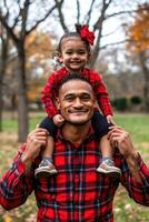 Loving Father and Daughter Embrace in Vibrant Autumn Park photo