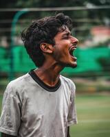 Enthusiastic Indian Man Expressing Excitement During Sports Training Session photo