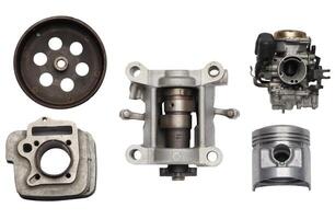 Spare parts of motorcycle scooter piston ,cylinder block, oil filter ,Valve and ball bearings on white background, Flat lay, photo