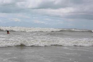 bad weather waves of a sea storm. summer landscape with sea, sky, waves and sand. view of the blue sea and the horizon. photo