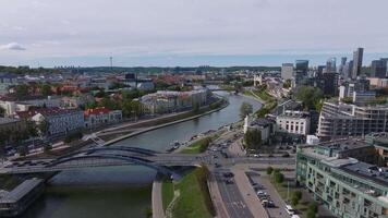 Aerial view of Vilnius, Lithuania, featuring the Neris River, Vilnius TV Tower, and a mix of historical and modern architecture. video
