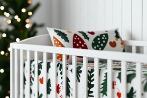 Cozy nursery with festive bedding and Christmas tree ambiance. photo