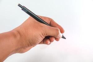 hand holding pen, hand writing isolated on white photo