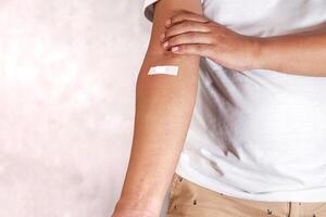 hand shows arm with injection marks photo