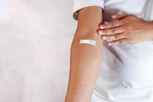 hand shows arm with injection marks photo