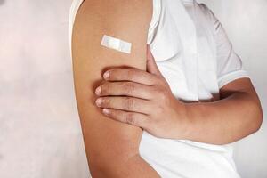 hand shows arm with injection marks photo