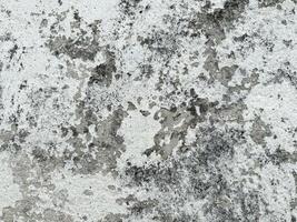 Weathered wall texture with gray and white patterns photo