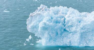 Massive iceberg floating in arctic ocean. . photo