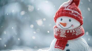 Christmas winter background with snowman in red knitted scarf and hat in snow and blurred bokeh background. Happy New Year and Merry Christmas greeting card. copy space. photo