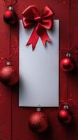 blank card with red bow, place for Christmas greeting text, decorated red background with Christmas decorations, balls and bow, holiday vertical copy space concept, seasonal messages photo