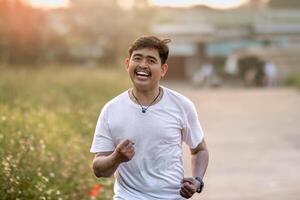 a man who stood and smiled goofily. The man acted like he was running. set in nature on a sunny afternoon. photo