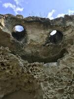 Natural rock in the form of a flying demon. Smiling bat. Bakla, Crimea. photo