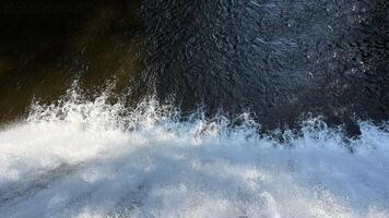 A small mountain river with a flow of water in the Polish mountains. Eastern Sudetes photo