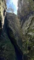 Sun rays pass through the stones in a cave. Poland photo
