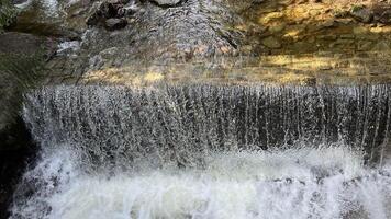A small mountain river with a flow of water in the Polish mountains. Eastern Sudetes photo