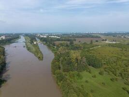 Mudflow of water in the Oder River of brown color. Poland. View from above. Background. photo