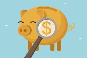 Magnifying glass points to dollar in piggy bank vector