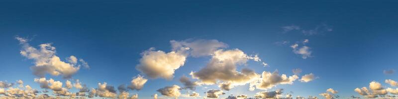 Dark blue sunset sky panorama with Cumulus clouds. Seamless hdr pano in spherical equirectangular format. Complete zenith for 3D visualization, game and sky replacement for aerial drone 360 panoramas. photo